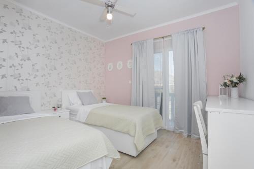 Posteľ alebo postele v izbe v ubytovaní Apartman Slavice