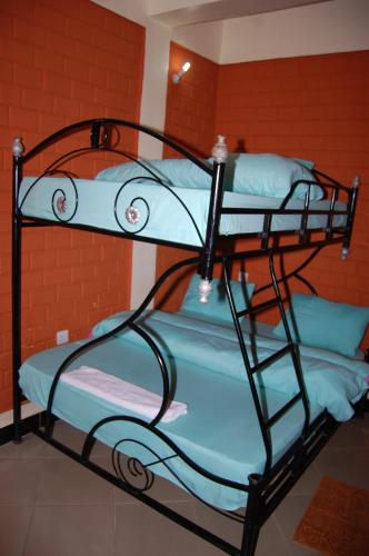 a couple of bunk beds in a room at Kakakuona Resort in Lushoto
