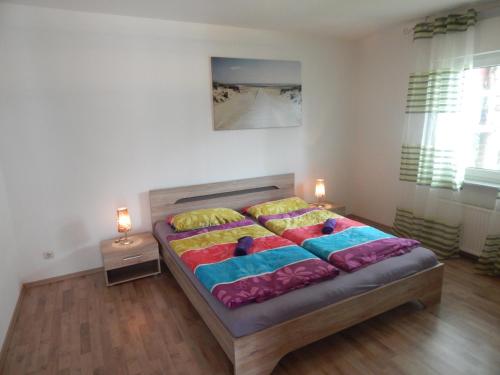 Ένα ή περισσότερα κρεβάτια σε δωμάτιο στο Ferienwohnung Insel Rügen - Haus Albatros