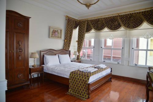 Postel nebo postele na pokoji v ubytování Çalıkuşu Tarihi Beşevler