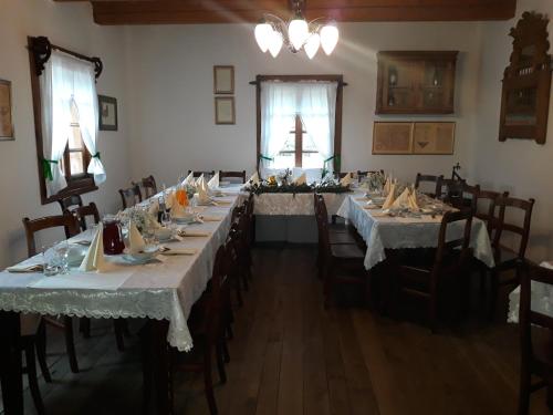 a large dining room with long tables and chairs at Polana Sosny in Niedzica Zamek