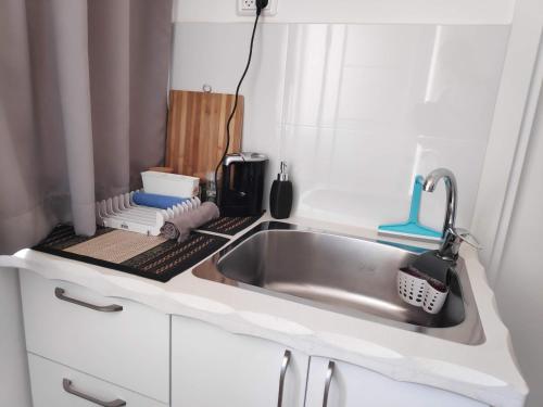 a kitchen counter with a sink in a kitchen at Dead Sea Desert's Edge in Arad