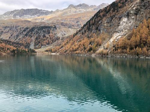 a lake in the middle of a mountain at Hotel Flattacher Hof in Flattach
