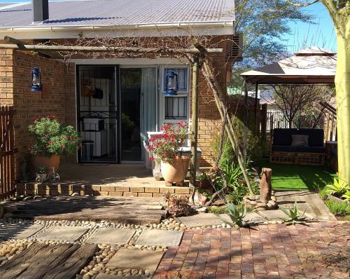 a front porch of a house with a patio at Bergsig 2A in Clanwilliam
