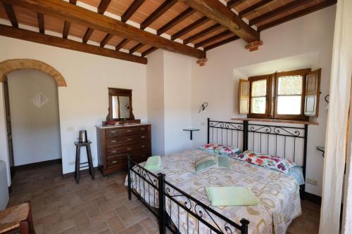 מיטה או מיטות בחדר ב-Agriturismo Santa Maria