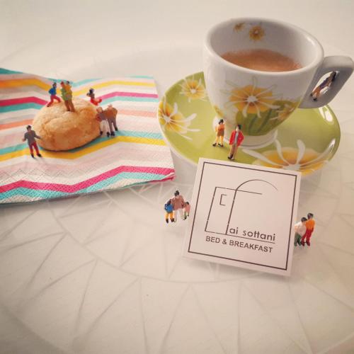 a cup of coffee next to a cup of tea at Ai Sottani B&B Deluxe Suite in Gioia del Colle
