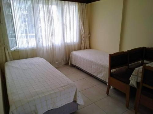Ένα ή περισσότερα κρεβάτια σε δωμάτιο στο Oya Family Suites