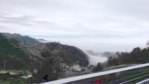 a view of a mountain with fog in the distance at King Villa in Heping