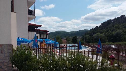 a pool with a water park in front of a building at Apartment Lake Tryavna in Tryavna
