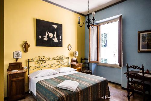 Кровать или кровати в номере Hotel Il Bargellino
