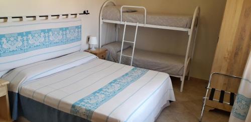 A bed or beds in a room at Meravisola Costa Rei