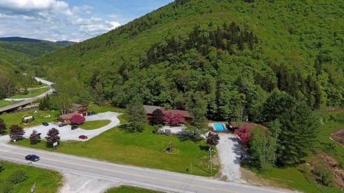 an aerial view of a house and a road at Cedarbrook Queen Studio 207 in Killington