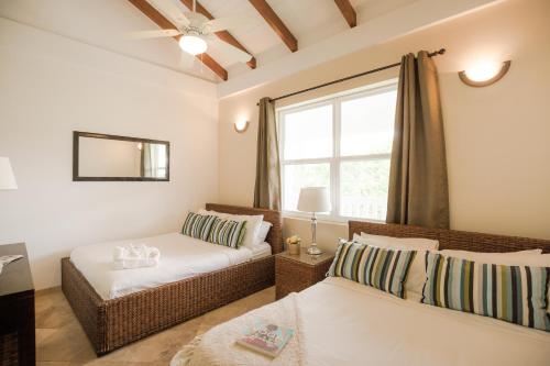 A bed or beds in a room at Umaya Resort & Adventures