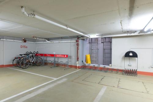a garage with bikes parked in a room at Hotel am Stadtgarten in Radolfzell am Bodensee