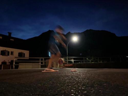 a person on a skateboard in the street at night at Ferienhaus Butterfly in Garmisch-Partenkirchen