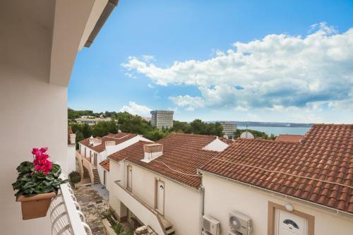 a view from the balcony of a house with roofs at Lavica Seaside Apartments, Podstrana in Podstrana