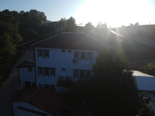 an overhead view of a white house with the sun behind it at PASHA APART~BOUTİQUE HOTEL/YALOVA in Yalova
