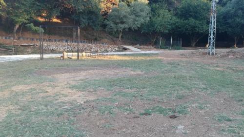 an empty field with a soccer goal in a park at PASHA APART~BOUTİQUE HOTEL/YALOVA in Yalova