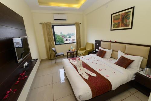 Una cama o camas en una habitación de Hotel Sanobar