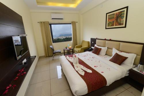 Una cama o camas en una habitación de Hotel Sanobar