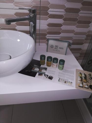 a bathroom counter with a sink and a box on it at Stella marina in Palinuro