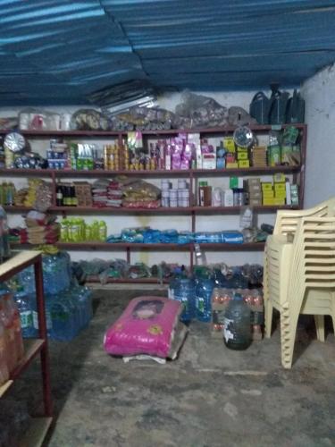 a room with a lot of items on shelves at Chez Bethy Jungle et Océan in Abene