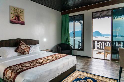 En eller flere senger på et rom på De Baron Resort
