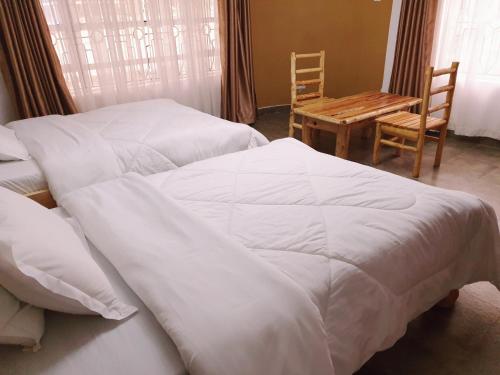 Postel nebo postele na pokoji v ubytování Merinja Guest House