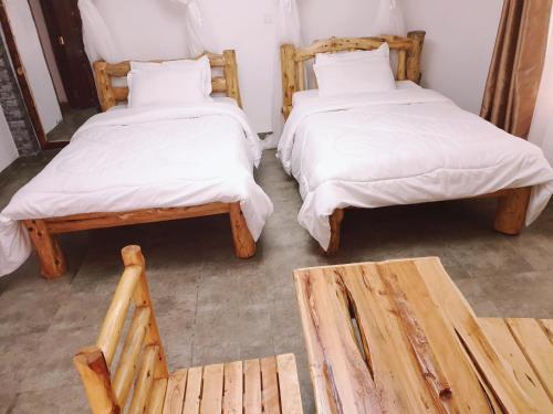 Postel nebo postele na pokoji v ubytování Merinja Guest House