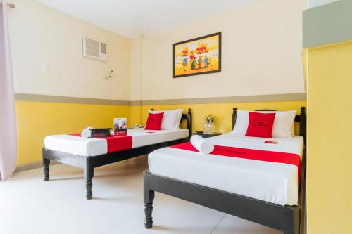 Voodi või voodid majutusasutuse RedDoorz Premium @ Gabinete Road Palawan toas