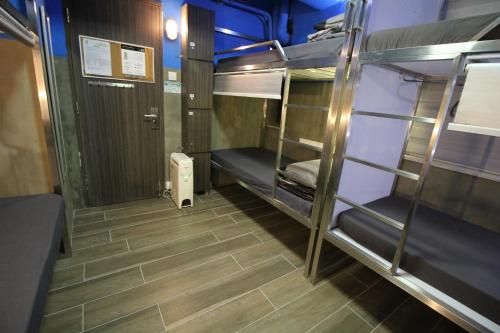 a small room with bunk beds on a train at Urban Pack in Hong Kong