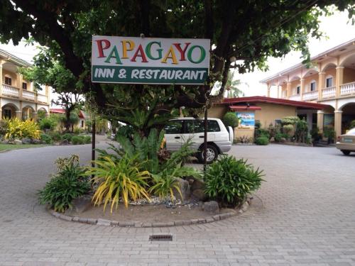 a sign for a maragogo inn and restaurant on a street at Playa Papagayo Beach Inn in Olongapo