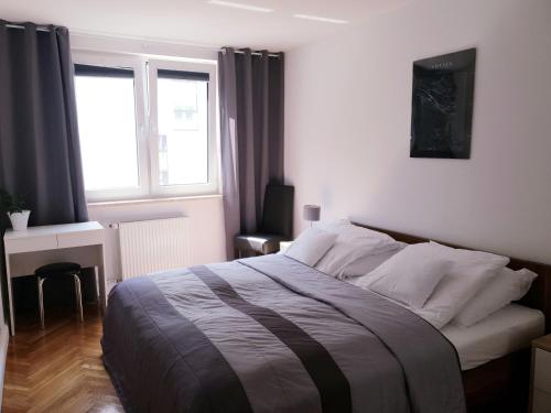 Ένα ή περισσότερα κρεβάτια σε δωμάτιο στο Apartament Kamienna Gdynia