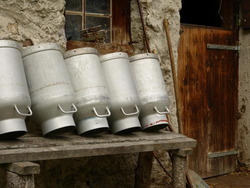 a group of white barrels sitting on a bench at Landhaus Lexner in Tux