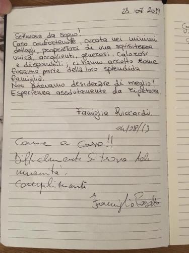 a diary with handwriting on it at La Casa del Sole in Marina di Pisticci