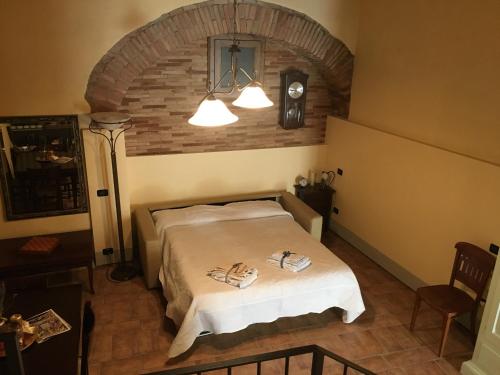 Postel nebo postele na pokoji v ubytování Loft De' Riccardi