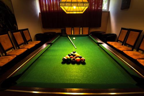 a pool table with balls on it in a room at Penzion Panda 2 in Turčianske Teplice