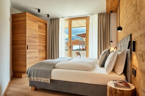 Ένα ή περισσότερα κρεβάτια σε δωμάτιο στο Les Contrades