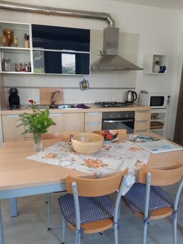 a kitchen with a table with a bowl on it at Casacobelli in Monzambano