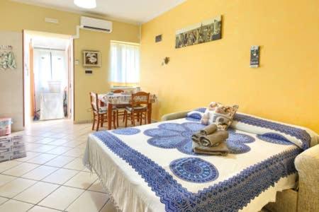 a bedroom with a bed with a teddy bear on it at La Collina in Salerno