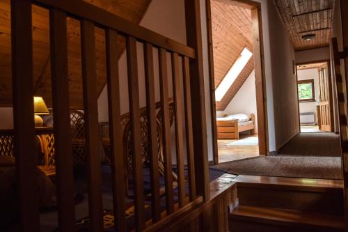 a staircase leading to the attic of a house at Horská chata Stará Horáreň 1 in Dobšiná
