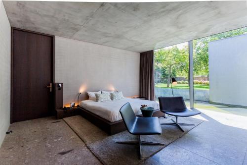 Postel nebo postele na pokoji v ubytování Notarishuys "Pure Hotel"