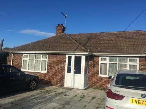 a red brick house with a white door at Seaside resort in Felixstowe