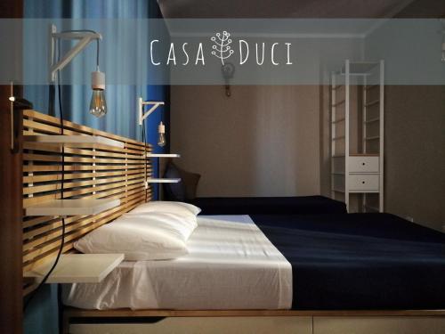 Postel nebo postele na pokoji v ubytování Casa Duci