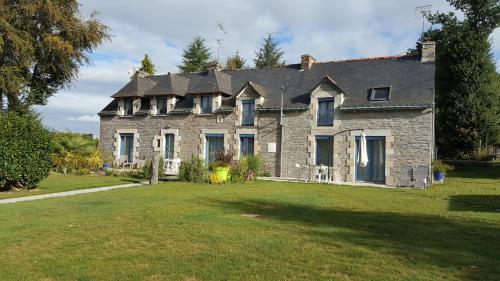 a large stone house with a large yard at les hortensias in Saint-Just