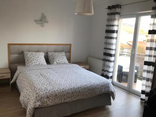 Posteľ alebo postele v izbe v ubytovaní I.K. APARTMENTS