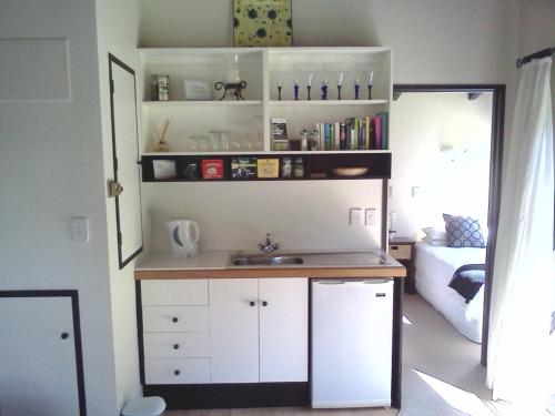 a kitchen with a sink and a counter in a room at Waters Edge B&B in Kaitaia