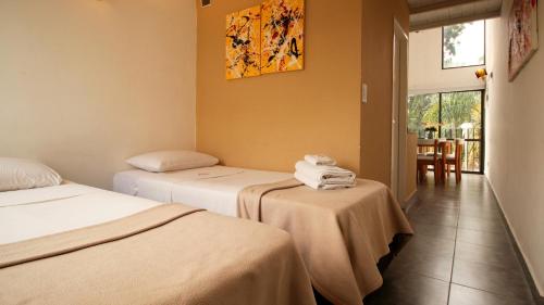 Ένα ή περισσότερα κρεβάτια σε δωμάτιο στο Puerto Tigre