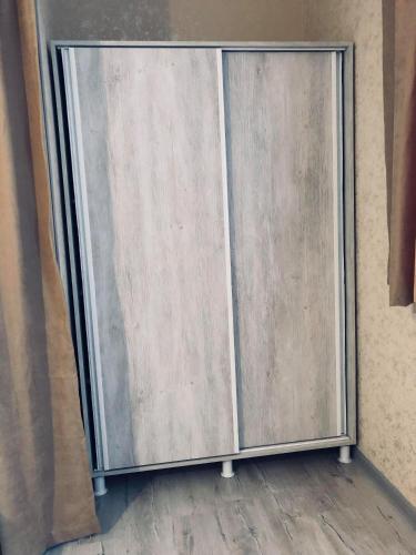 a sliding metal door on a wall at PAPILLON in Chakvi