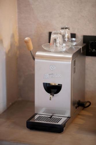 a coffee maker sitting on top of a counter at Casa Nostra Boutique Hotel & Spa in Palermo